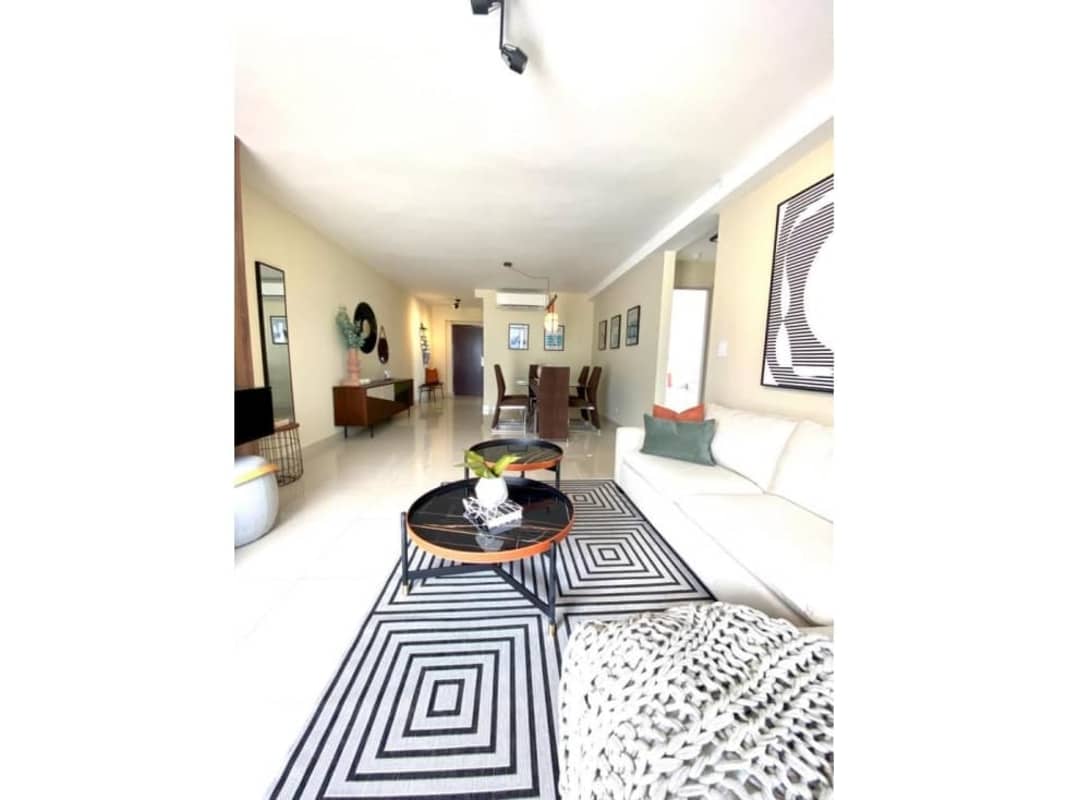 Open living dining room with ceramic floors and city skyline views PH Balboa Bay Panama