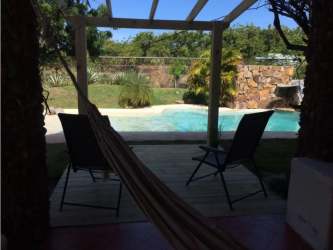 Master bedroom in Punta Chame beach house with AC, balcony garden views, closet