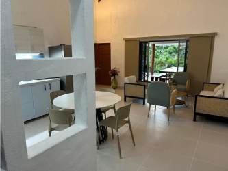 Living room with large sliding doors and dining area Coronado Equestrian Club Panama