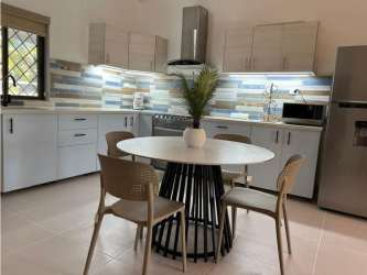 Modern beach house kitchen granite countertops dining nook Playa Coronado