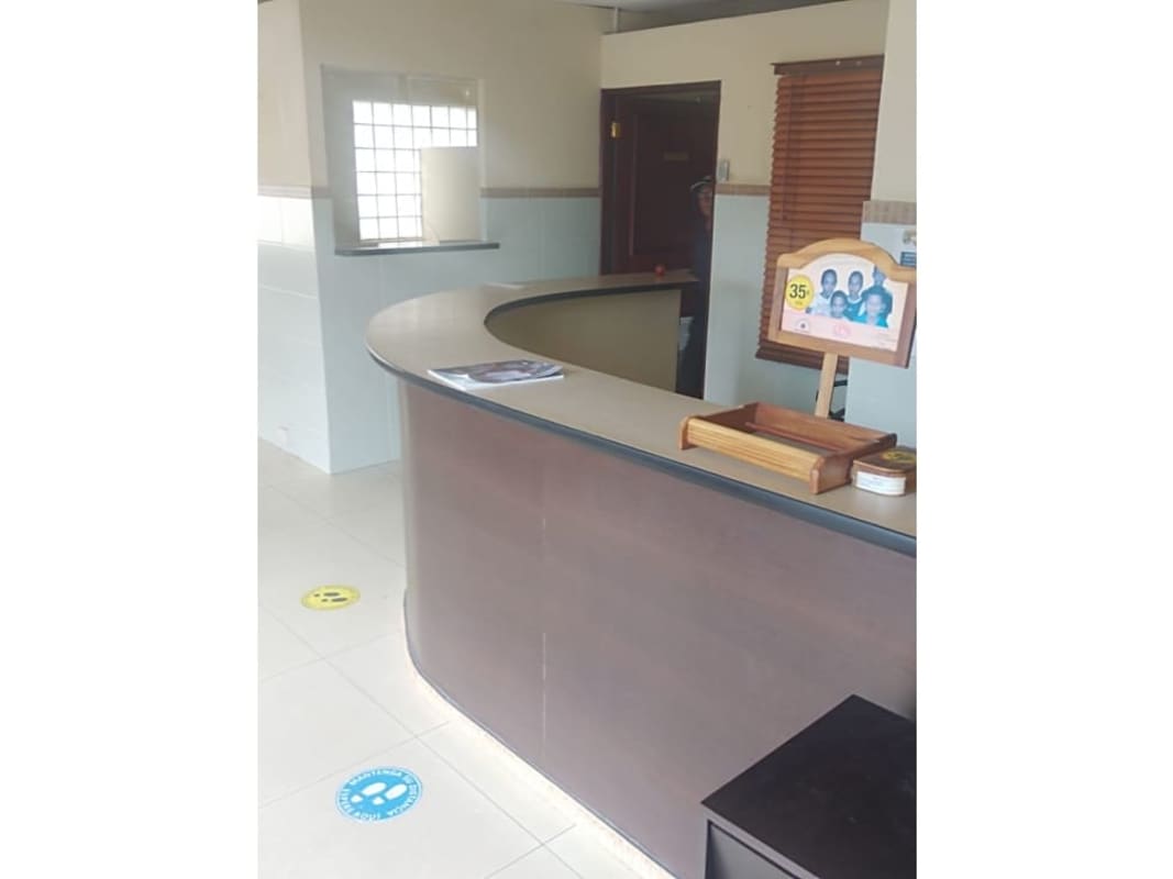 Office cubicles and glass-partitioned meeting area commercial real estate for rent Bella Vista