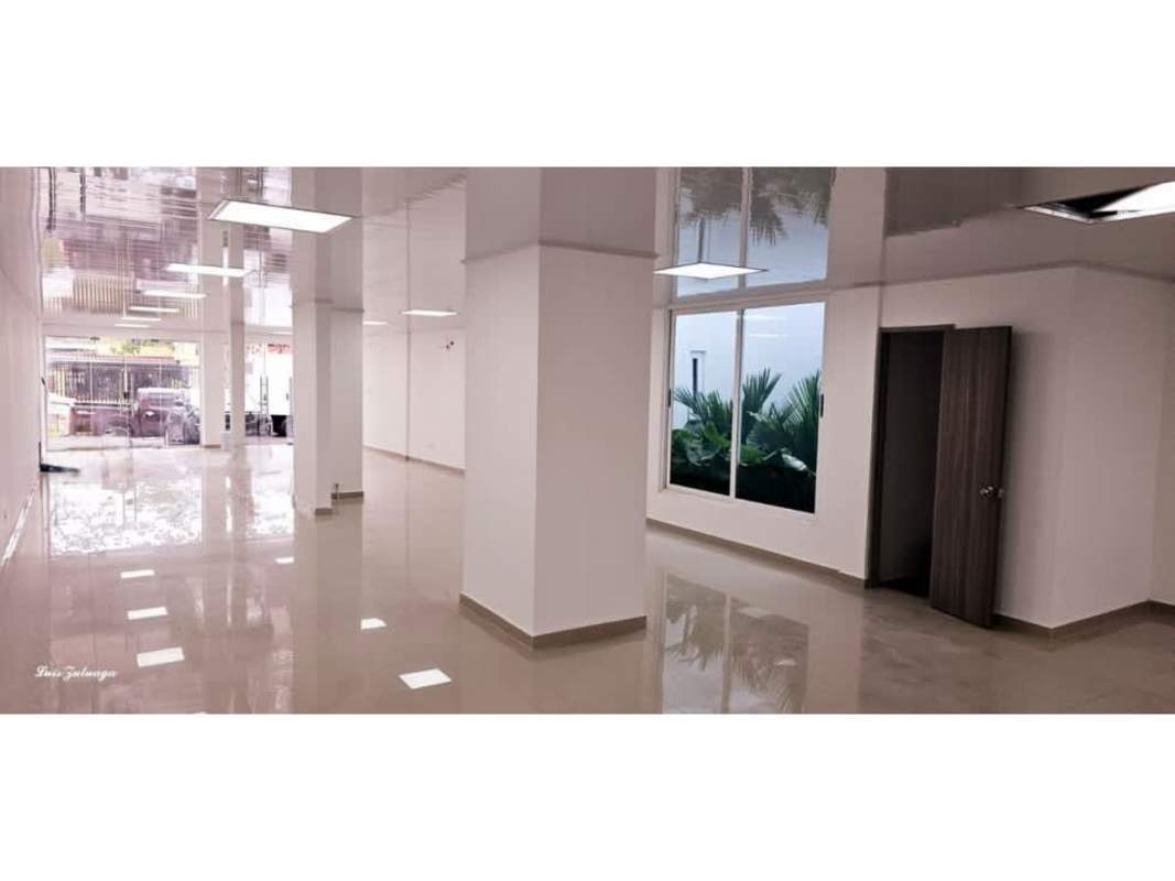 Expansive commercial space with open layout, ceramic tiles and support columns for versatile business use