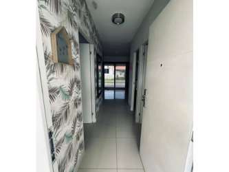 Ceramic tiled hallway with modern decorations in furnished beach house El Palmar Panama