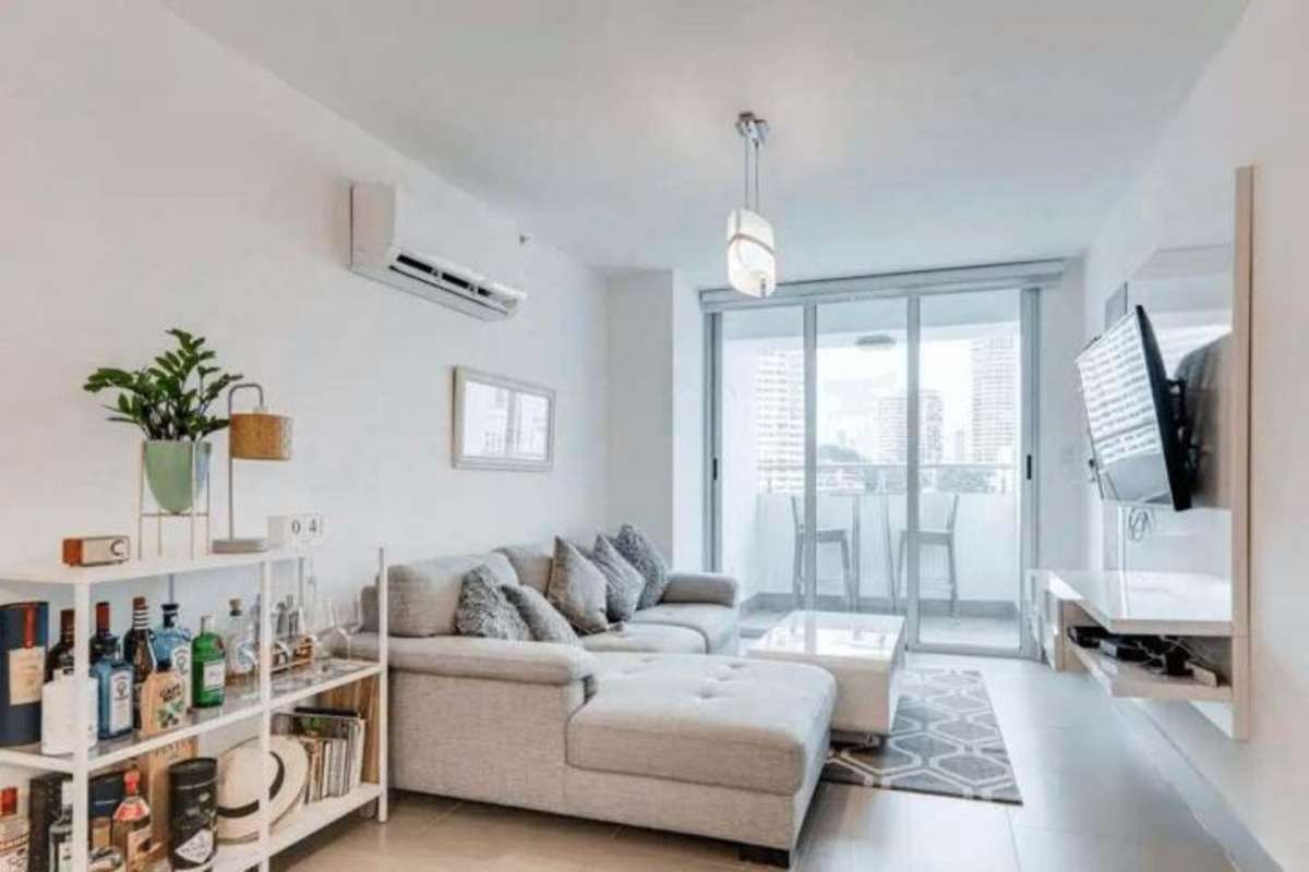 Spacious furnished master bedroom with floor-to-ceiling windows and en-suite bathroom PH Marbella 47 Panama