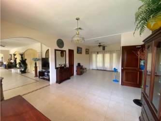Interior living room with arches, ceiling fan, tile floors Howard Panama house