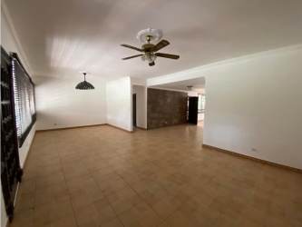 Living and dining area with ceiling fans and ceramic tile floors in Howard home Panama