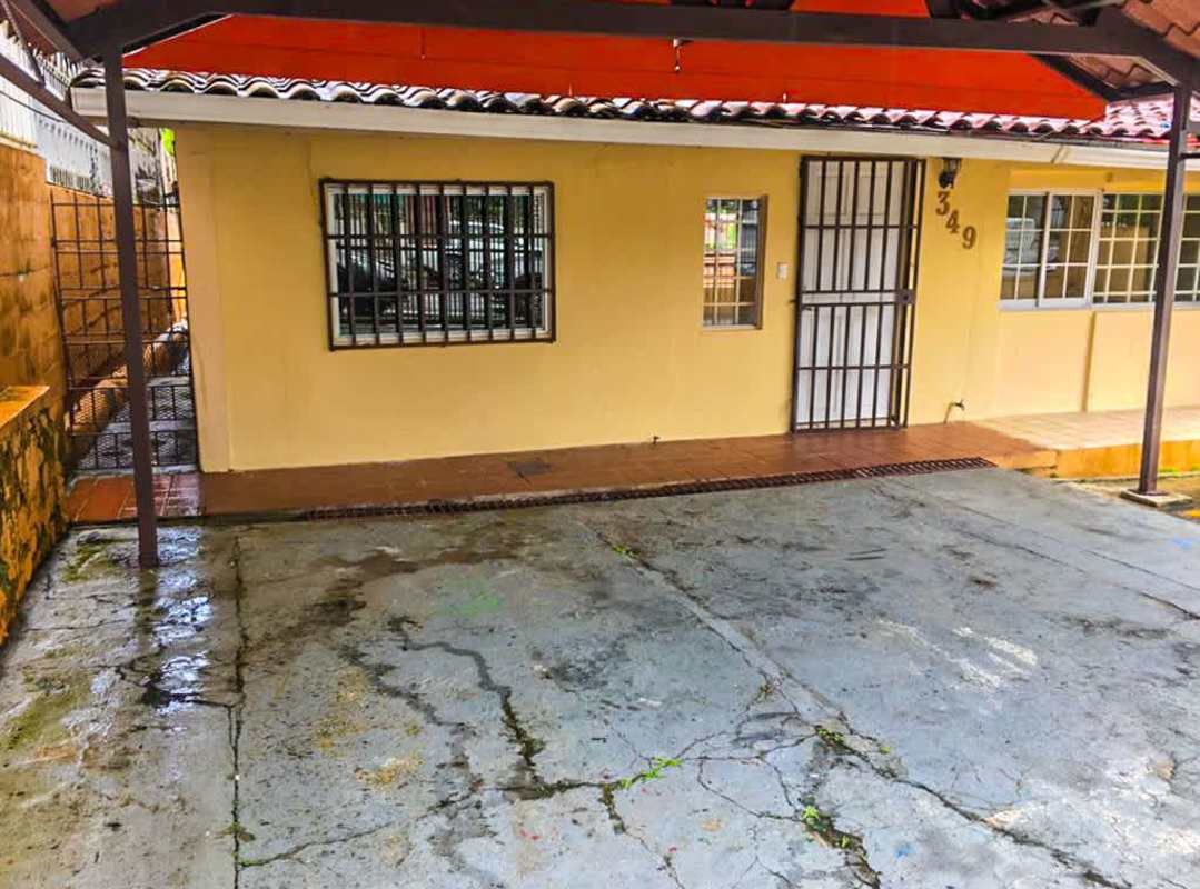 Covered parking carport with security gate in Betania Panama house for sale