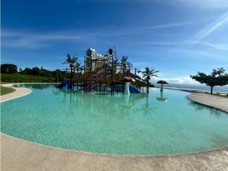 Modern balcony with glass railing panoramic Pacific Ocean view in Casamar Beach Resort Panama