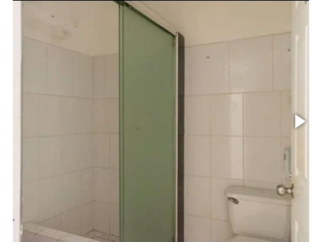 Small kitchenette with sink and shelves inside commercial lease space Centennial Mall Panama