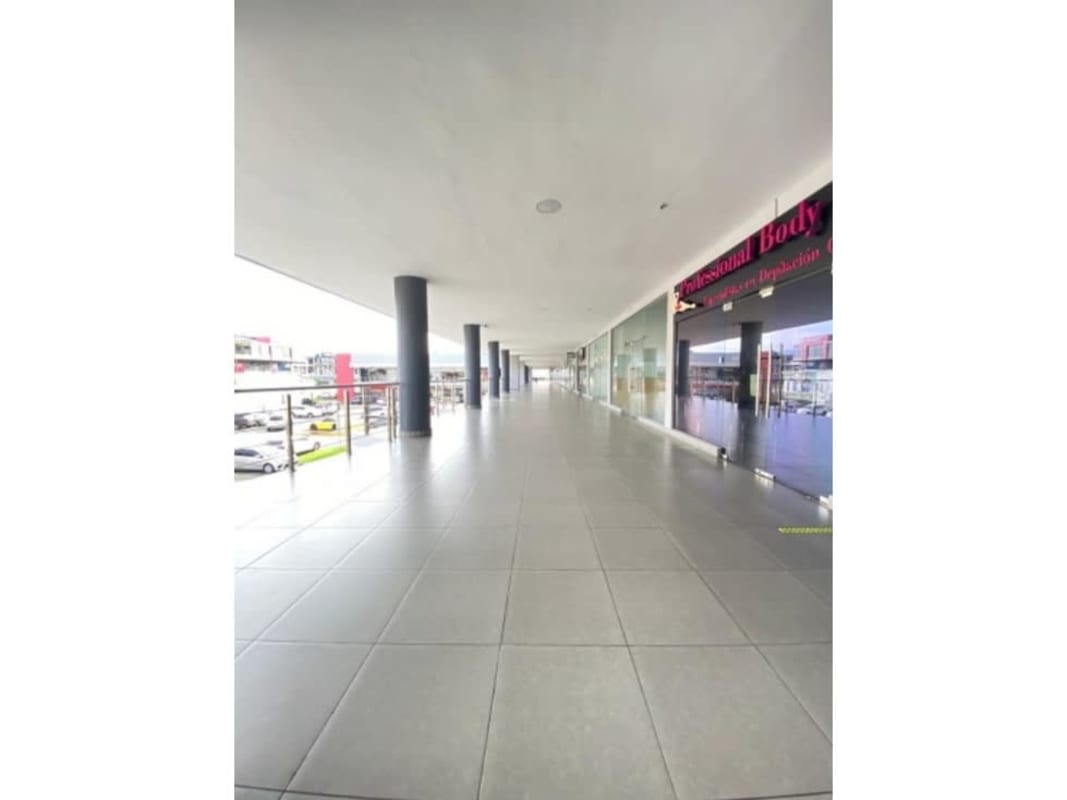 Tiled bathroom with shower and toilet inside Centennial Mall retail space