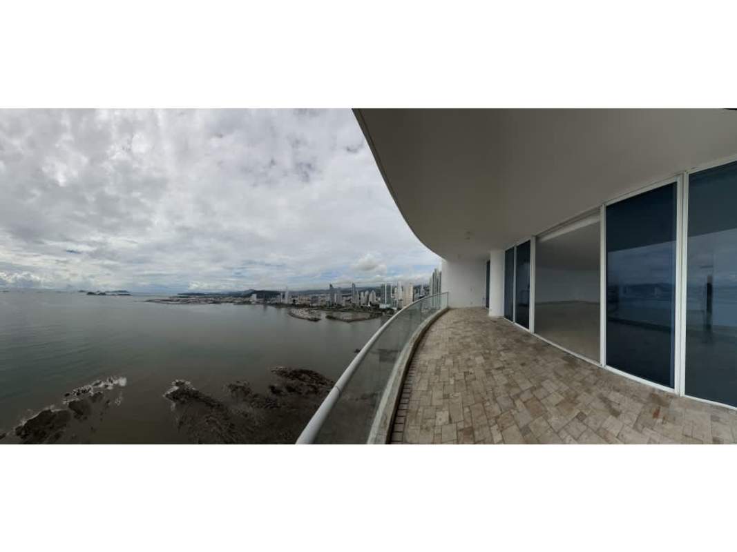 Large master bedroom in PH The Point with floor-to-ceiling windows enjoying ocean and Panama City skyline vistas.
