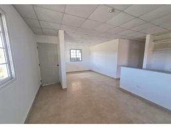 Living and dining space with ceramic floors at house in Altos Cerro Tigre Arraiján Panama