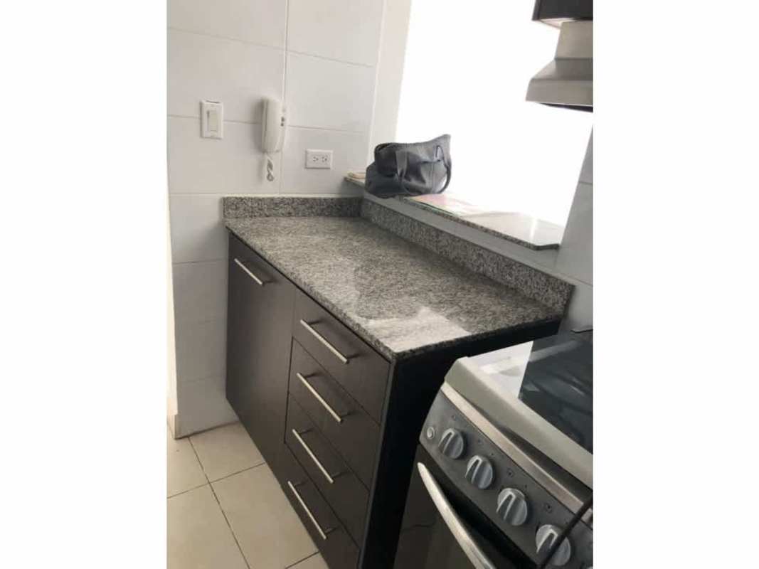 Modern kitchen with granite countertops, stainless appliances at PH Vivendi Towers Edison Park Panama