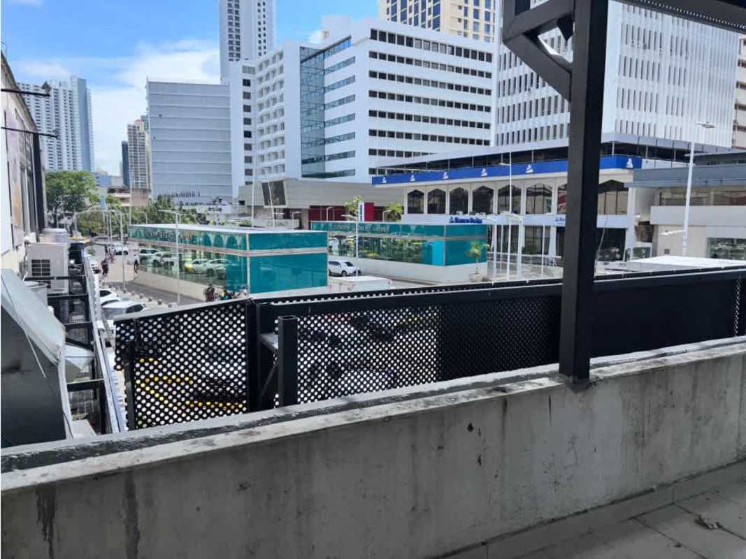 White modern commercial space with support columns and tiled floors Panama City