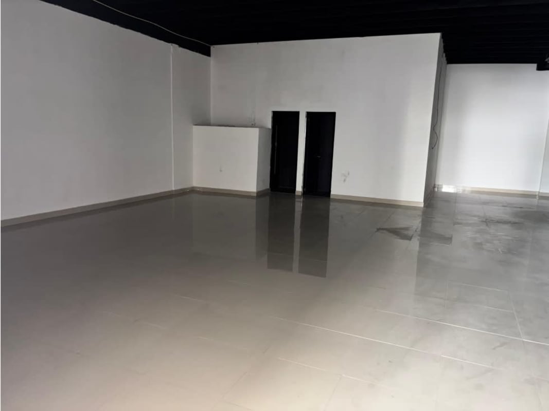 Empty business premises with polished tile floor, exposed black ceiling Panama City