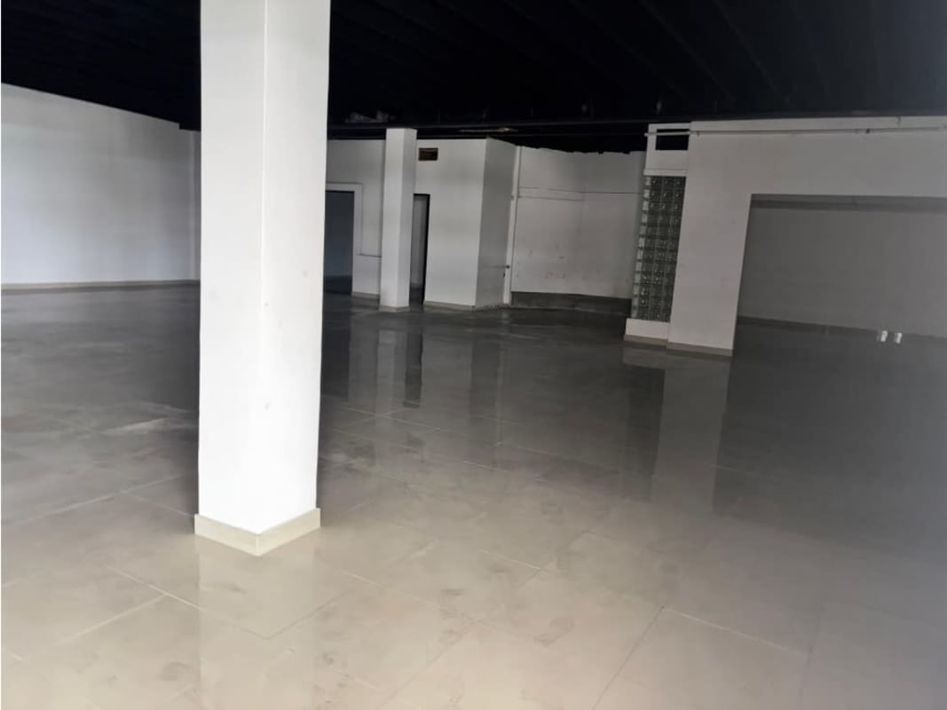 Empty open space with glossy tiles, white walls, black ceiling in Bella Vista Panama City