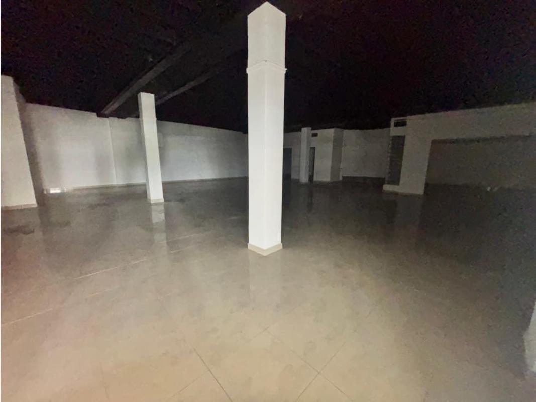 Large open commercial space with tiled floors and black ceiling Panama City