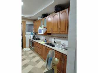 Fenced garden and perimeter wall with security wire Buena Vista Colón house yard.