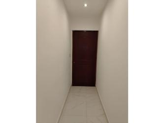 Spacious bedroom with green bedspread Buena Vista Colón house for sale Panama.