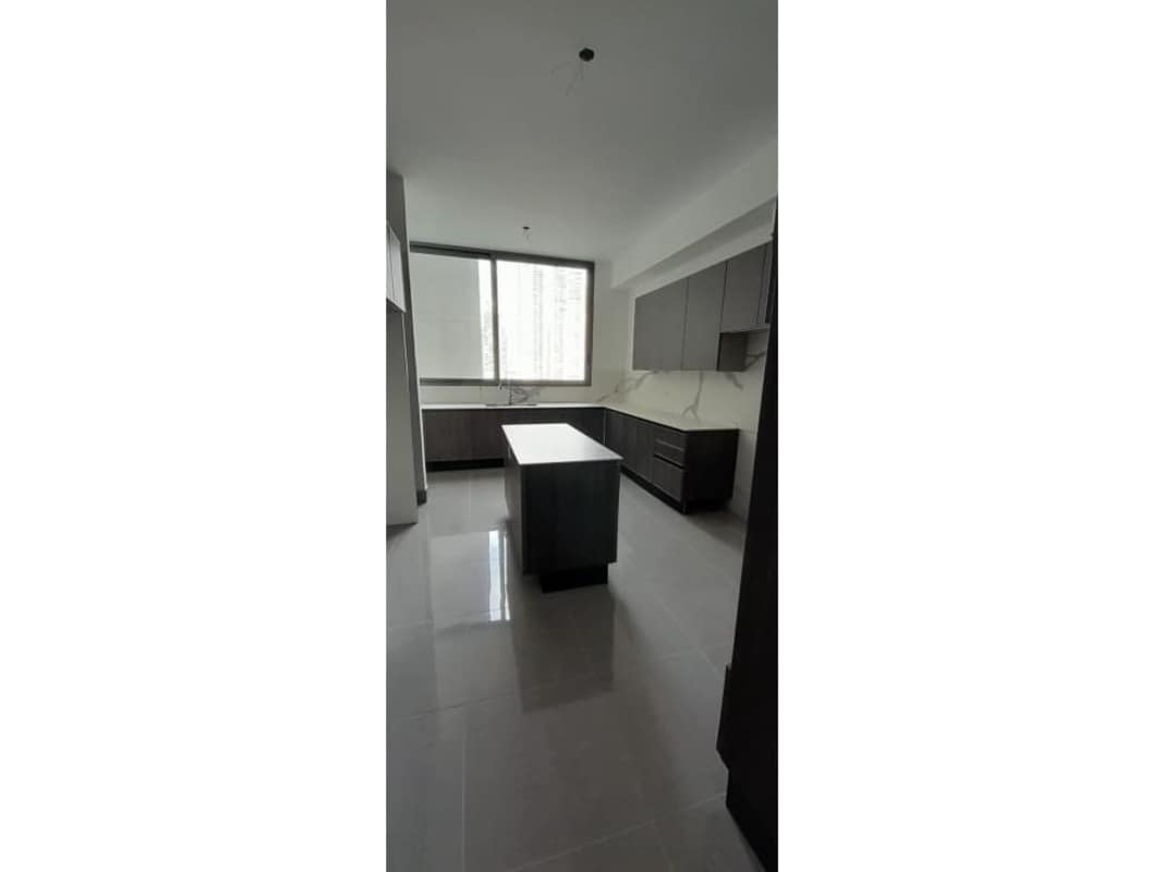 Contemporary bathroom with marble tiles, double sinks, glass shower in PH Sea Point Punta Paitilla Panama