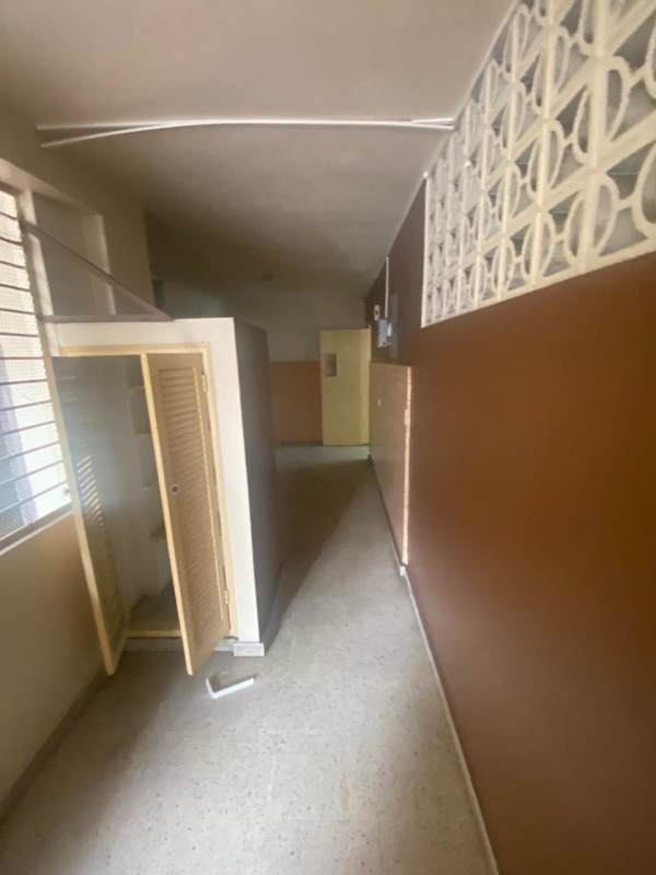 Retail or office space with black flooring, large windows with security bars Obarrio Via Brasil Panama