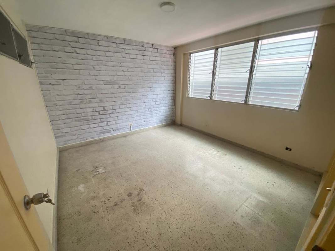 Empty interior open-plan space with security window grille on Via Brasil Panama City