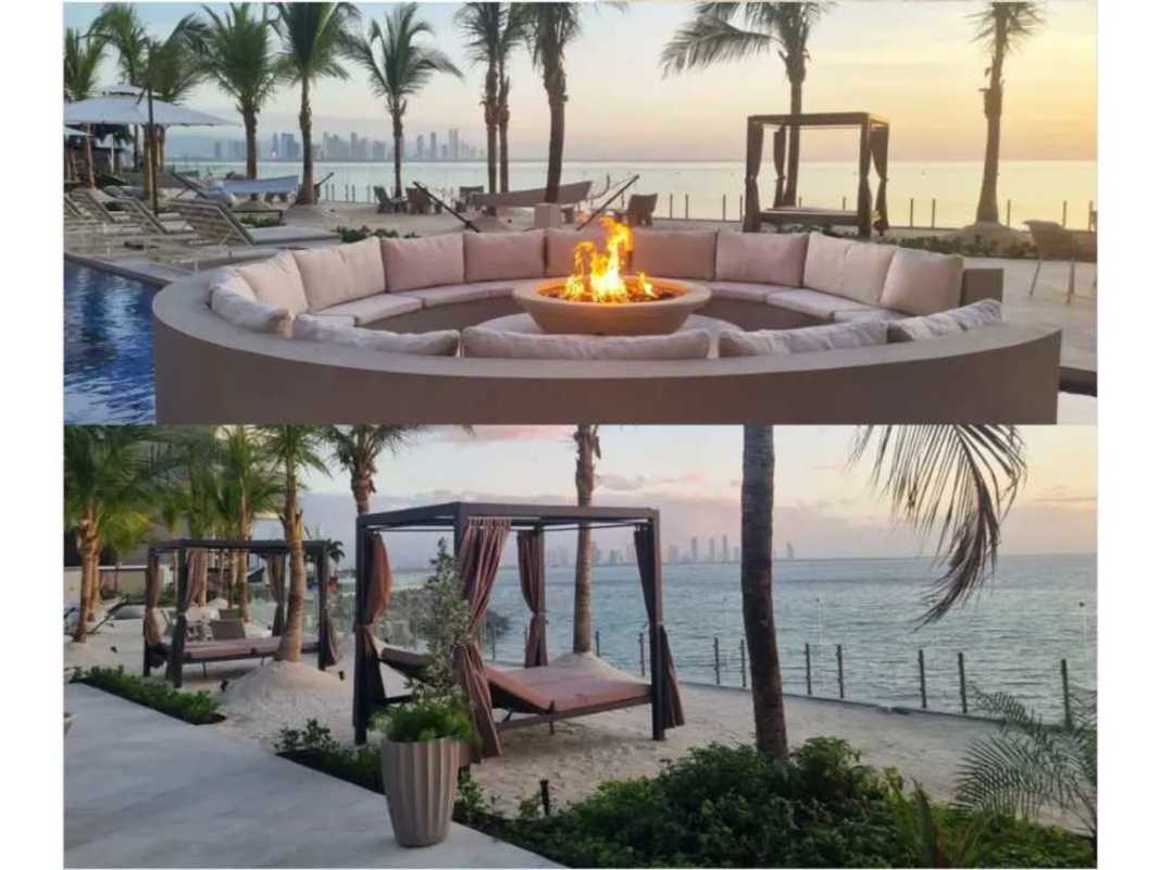 Beachfront resort pool with fire pit, lounge seating and ocean view at Ocean Reef Islands Panama City