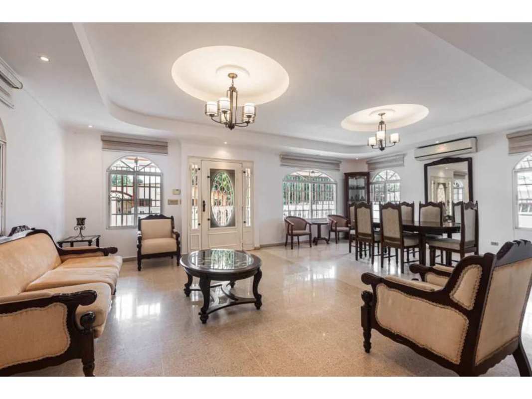 Spacious living room with entertainment center, air conditioning, tile floor at Villa Rica Rio Abajo