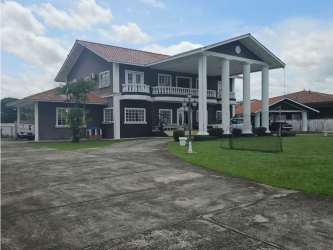 Spacious open concept living dining rooms with columns and tile floor Las Perlas estate David Panama