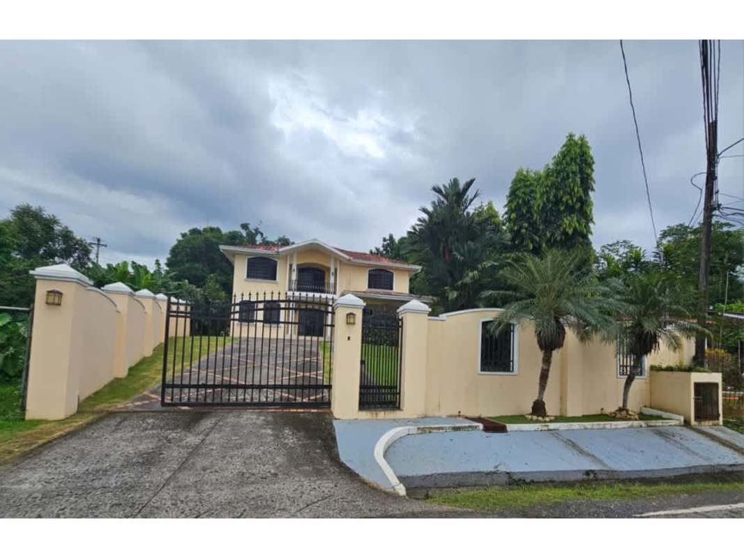 Spacious covered patio perfect for entertaining beside garden and pool in Villa Zaita Panama