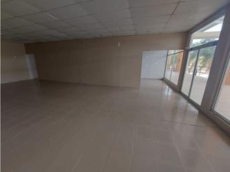Spacious empty retail or office space with large windows and ceramic tile floor in Plaza Coronado Panama