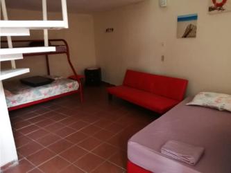 Guest house villa surrounded by garden with red tile roof in Coronado estate Panama