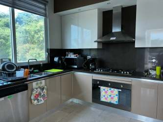 Large master bedroom with balcony ocean views in Bijao beach club condo for sale