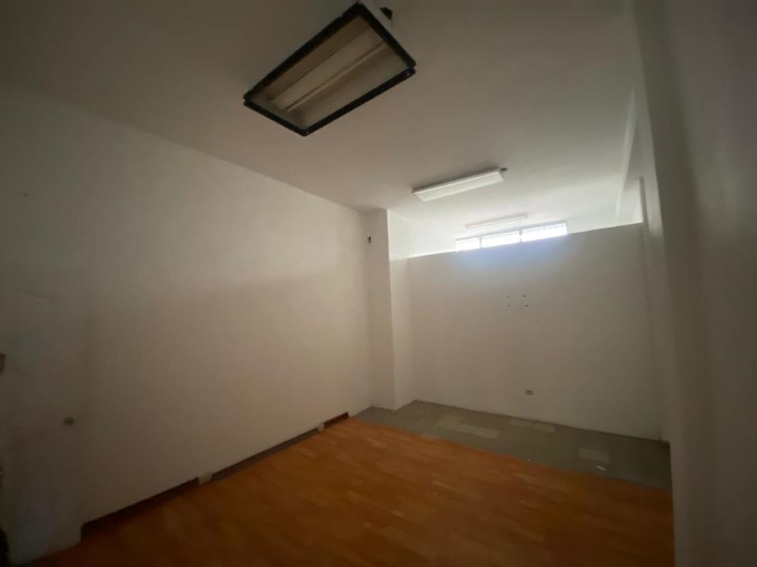 Empty office or showroom space with partitions and tiled floor at PH Vía Brasil Plaza Panama