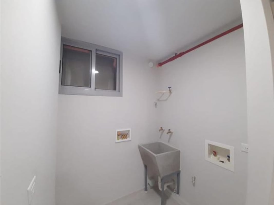 Modern bathroom with glass shower and white vanity in PH Bella Natura Los Andes Panama City