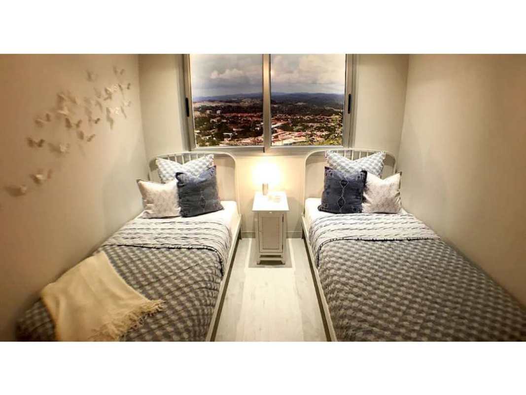 Bedroom with built-in closet ceramic tiles and window in PH Bella Natura Los Andes Panama City new apartment