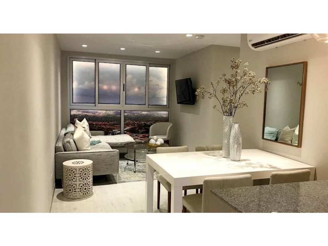 Modern granite countertop kitchen with cabinets in PH Bella Natura Los Andes new apartment Panama