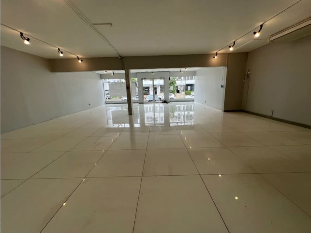 Showroom interior with double height glass facade Obarrio