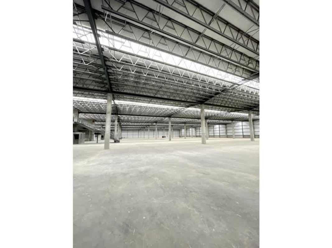 Interior open-plan warehouse with concrete floor, steel columns, high ceiling Don Bosco Panama