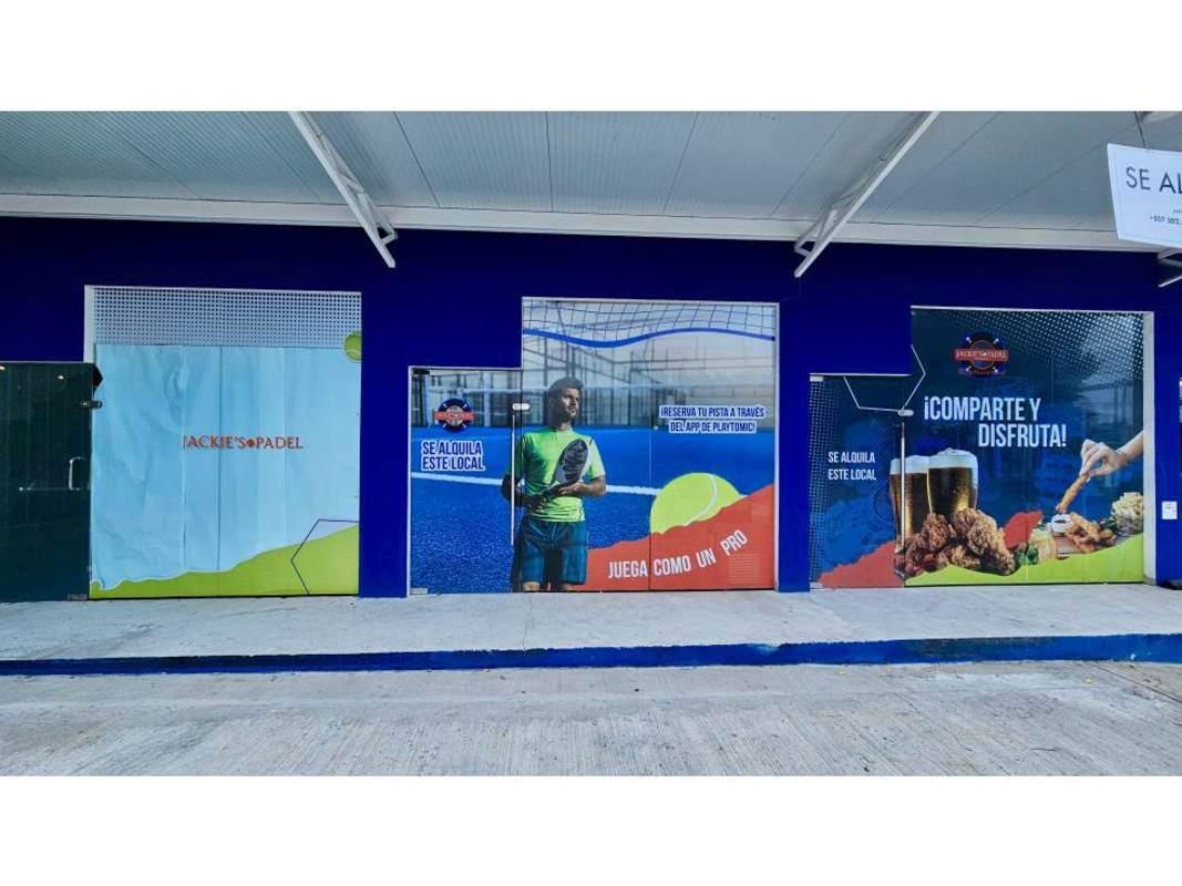 Storefront facade with padel club advertising banners in Costa del Este area commercial plaza Panama City.