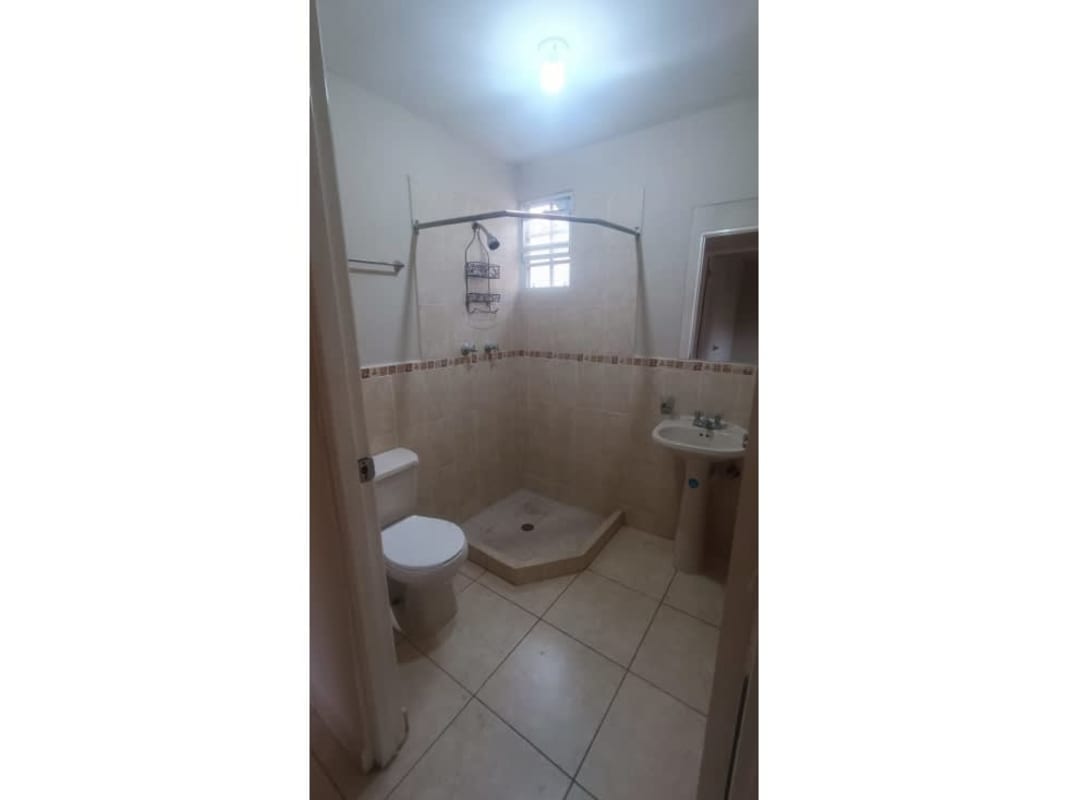 Bedroom with neutral paint, tiled floors and ceiling fan in Arboledas Costa Verde
