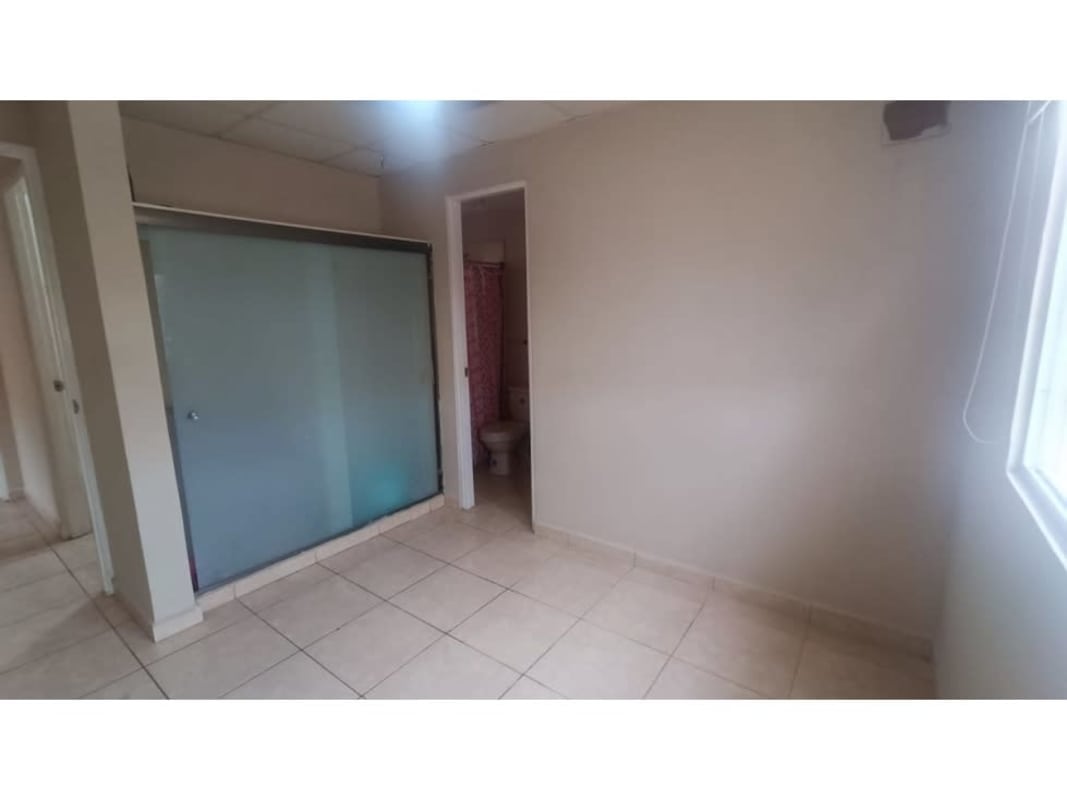 Small bathroom with corner shower and beige tiles in Arboledas Costa Verde Panama