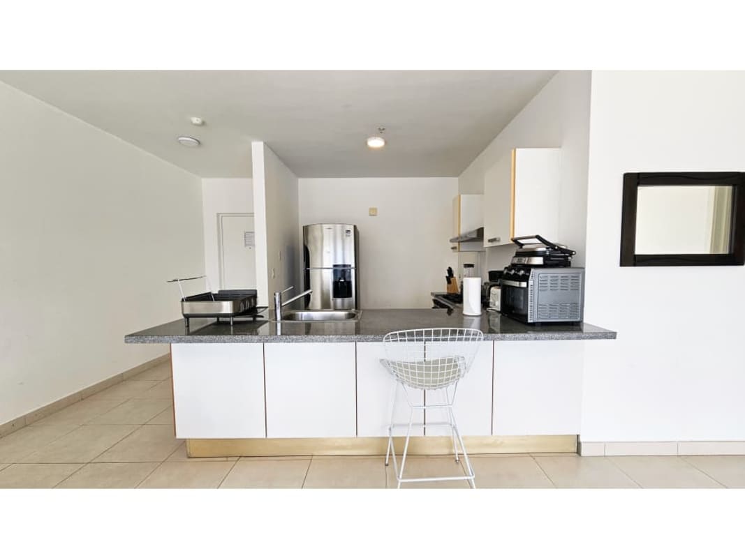 Open kitchen with granite countertops, stainless appliances PH Waters on the Bay Panama City