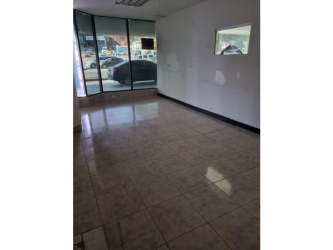 Wide interior of retail commercial unit with tiled floor and storefront windows El Dorado Panama City