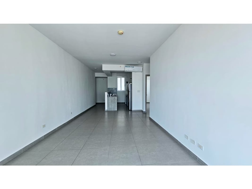 Open plan living area with ceramic floor and modern kitchen in PH Signature Point Panama