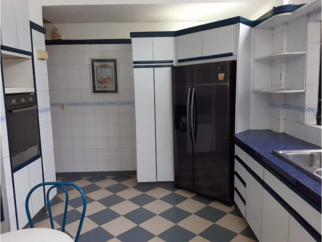 Walk-in closet with wooden shelves and cabinets in Betania Panama