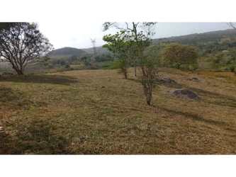 Open grassy field with fencing and mature trees in La Chorrera Panama for sale