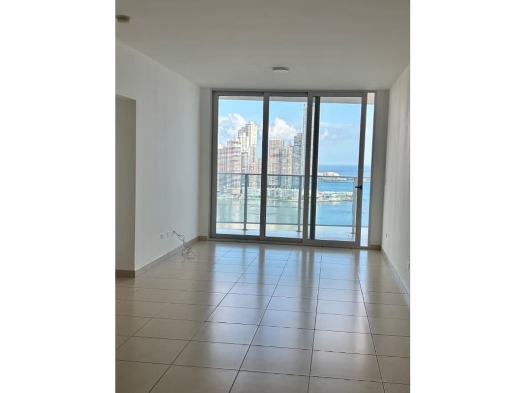 Kitchen with granite countertops, breakfast bar, and appliances at PH White Avenida Balboa Panama