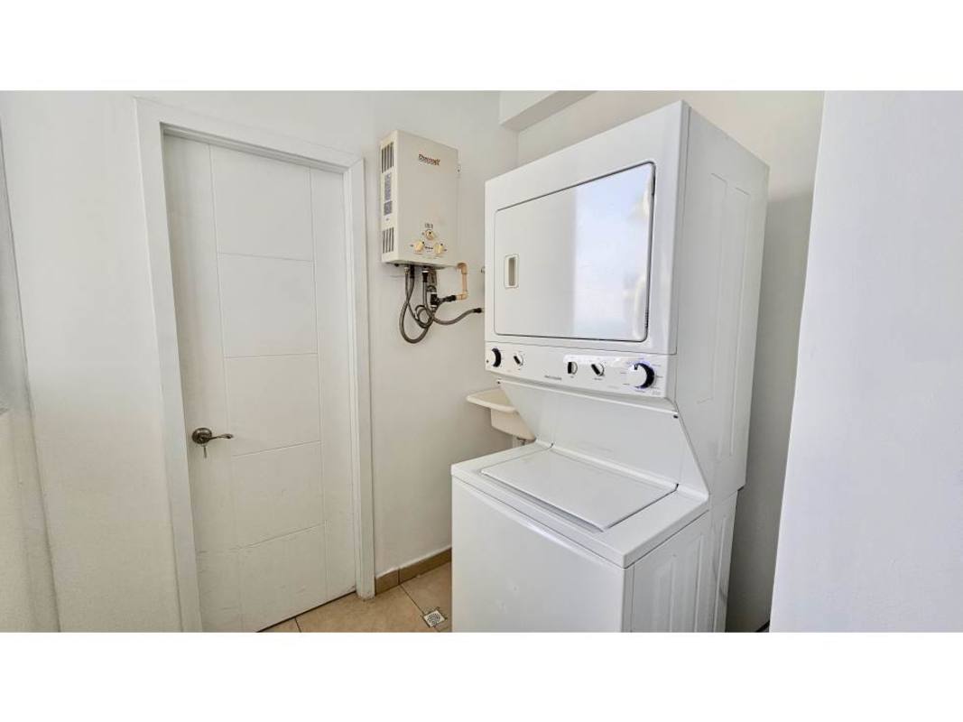 Contemporary bathroom with floating vanity and neutral tiles in luxury condo Punta Pacifica Panama