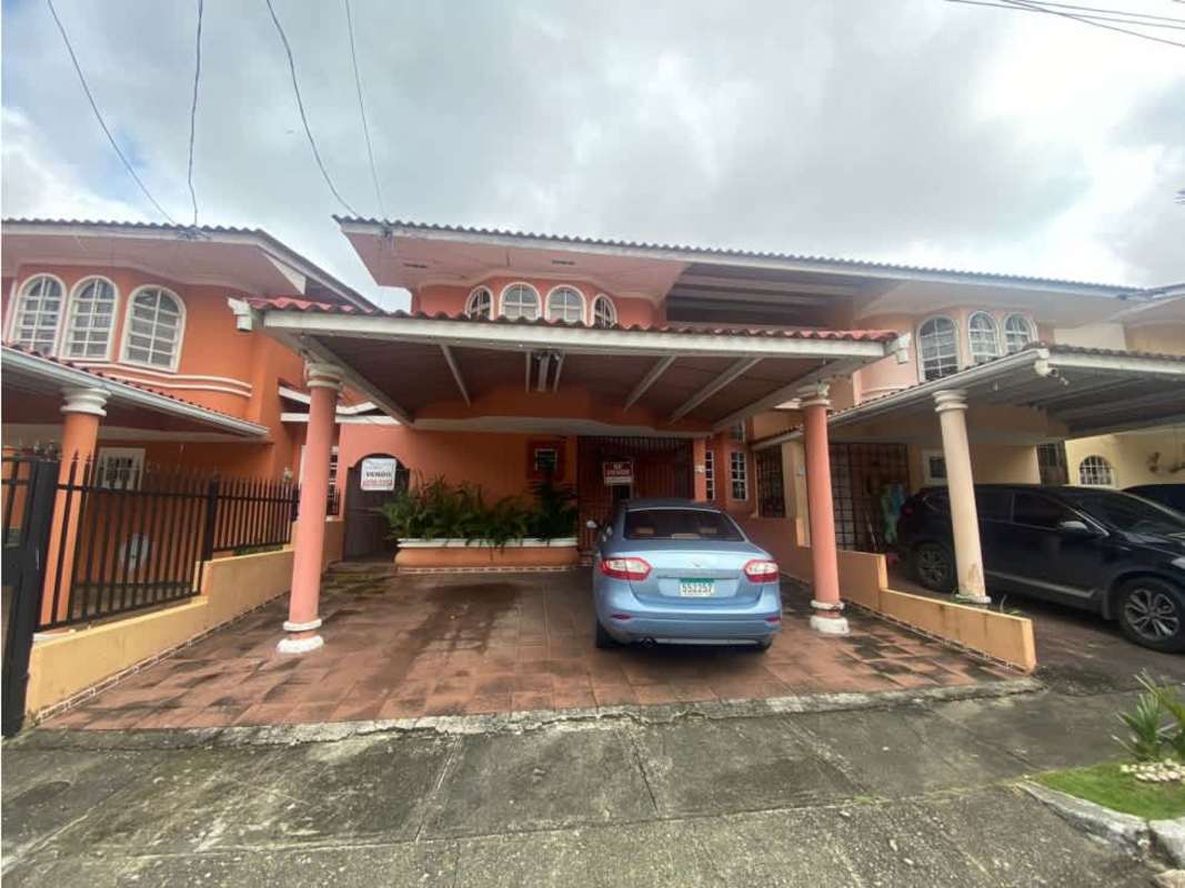 Kitchen with tile counters, breakfast bar, upper wooden cabinets in Condado Gardens Condado del Rey